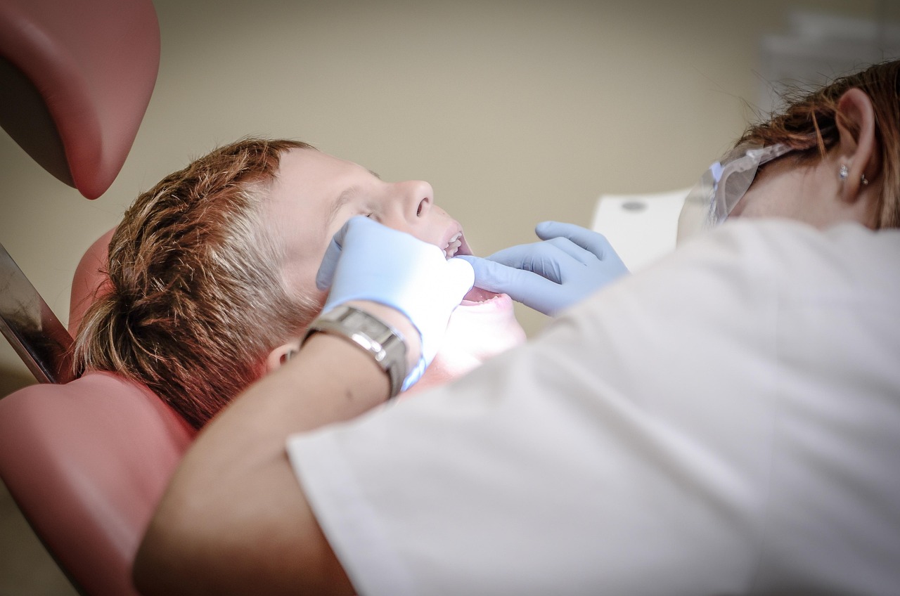 Dental professional caring for a patient in a clinic